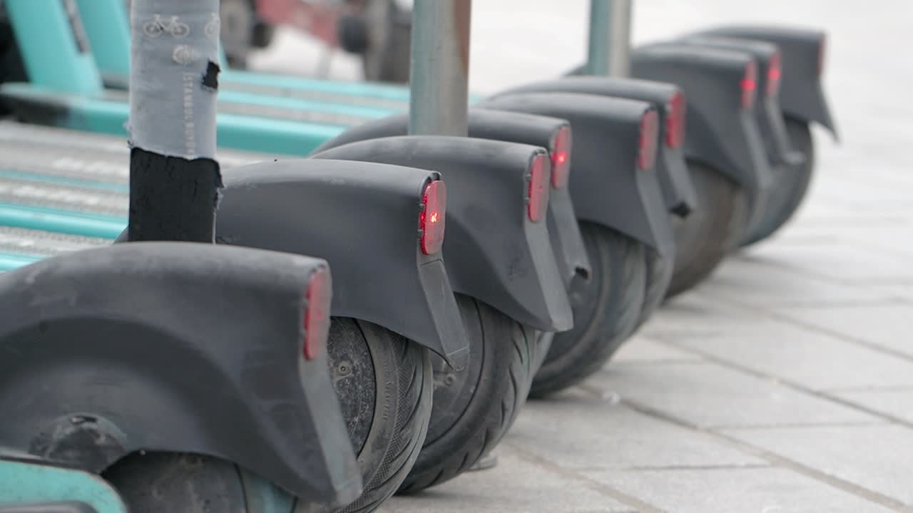 Electric Scooters Parked in a Row
