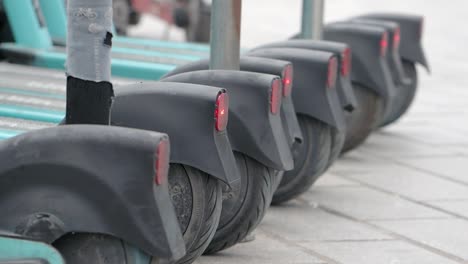 electric scooters parked in a row