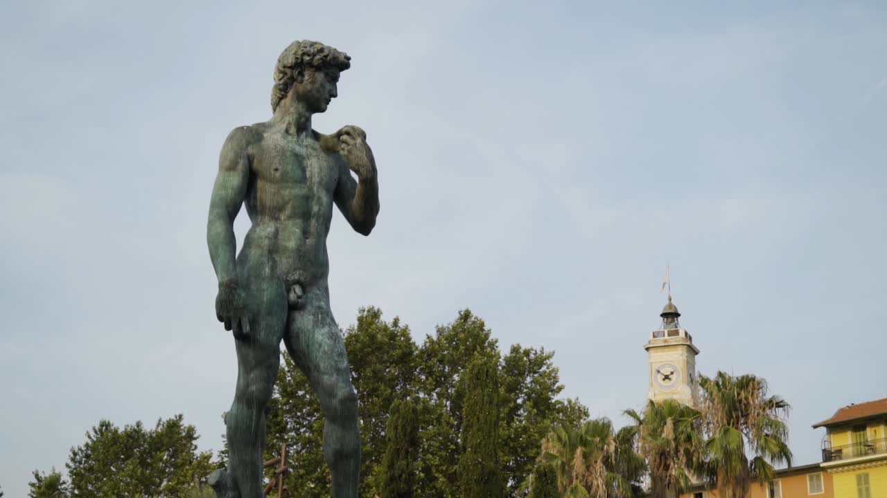 Statue of David in a city setting