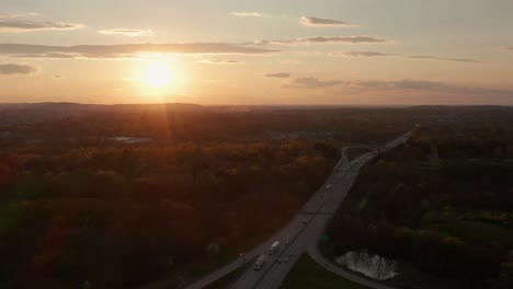 descending aerial reveals usa interstate highway expressway at sunset