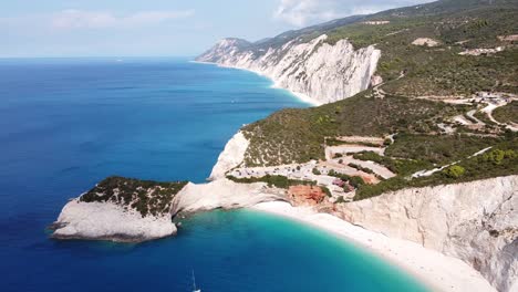 boats floating at porto katsiki beach, lefkada island, greece - reversing aerial