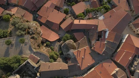 aerial rising vertigo over roofs at monsanto village, portugal