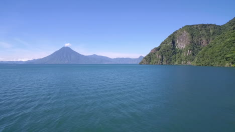 aerial over lake amatitlan in guatemala reveals the pacaya volcano in the distance 3