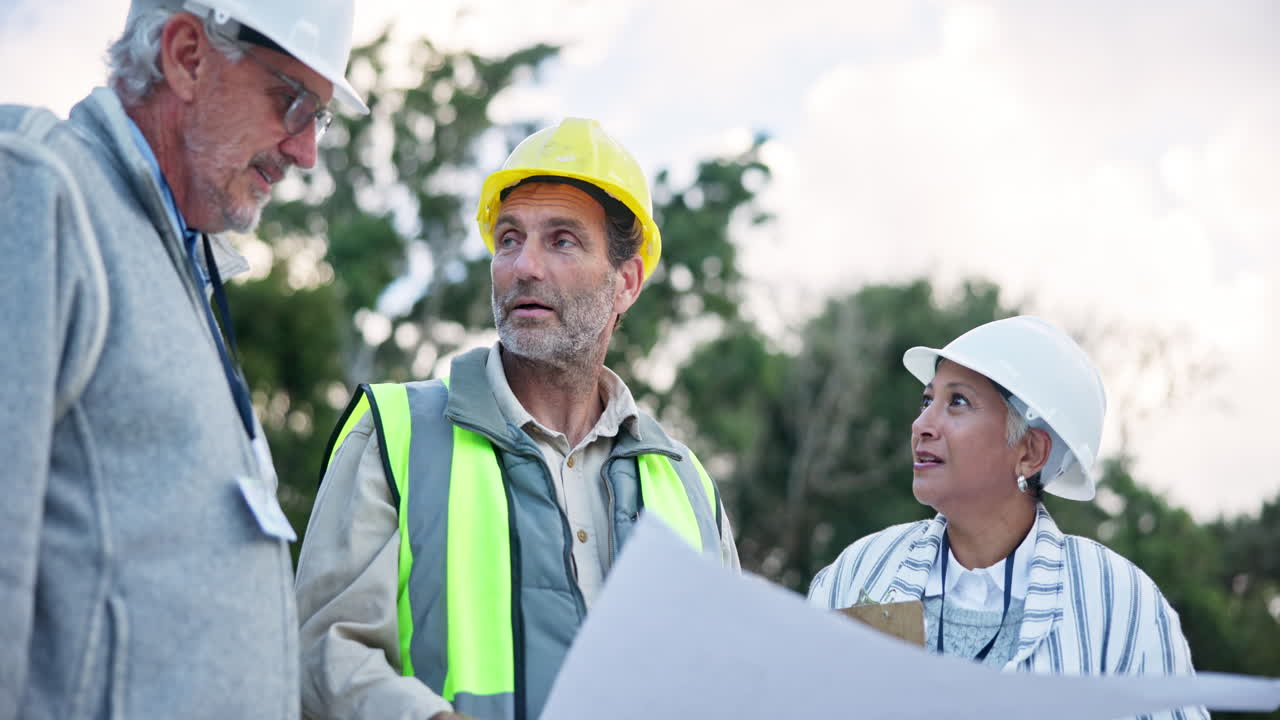 Construction Team Discussing Blueprints
