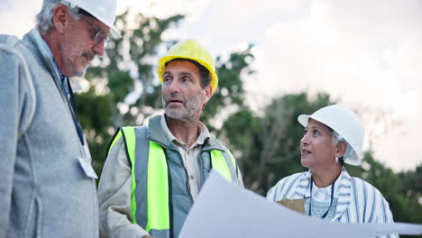 construction team discussing blueprints