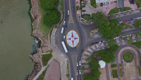 obelisk in juan baron plaza along malecon of santo domingo, in dominican republic. aerial top-down ascending