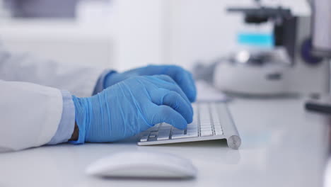 hands, computer and scientist typing for analysis