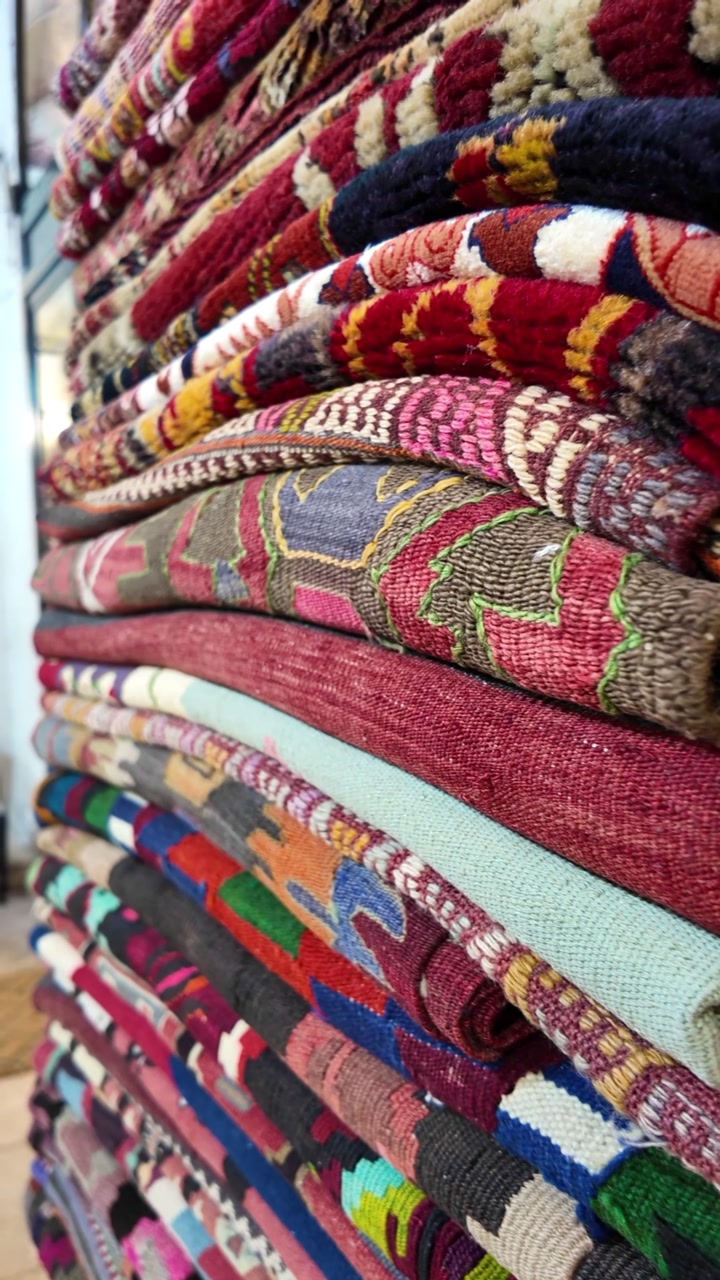 Close-up of Stacked Colorful Handmade Rugs