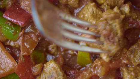 delicious beef stew with tomatoes and bell peppers