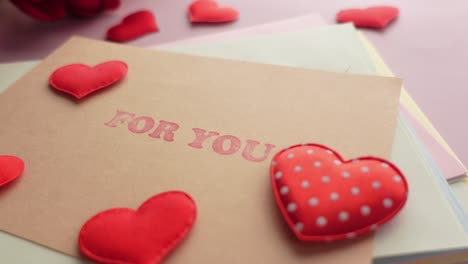 Heart-shape-symbol-and-envelope-on-red-background