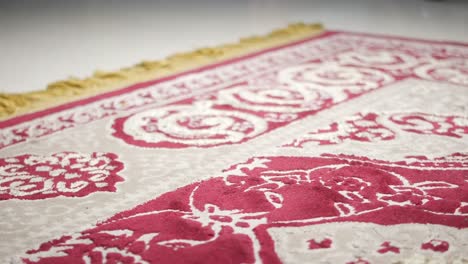 red and beige prayer rug