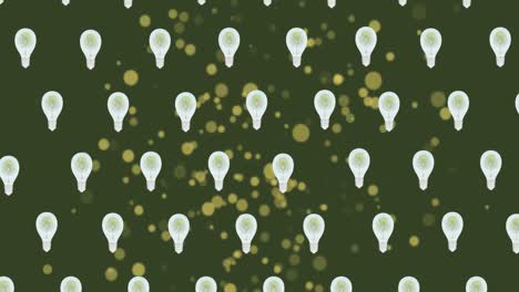 Animation-of-lightbulbs-and-green-spots-on-green-background