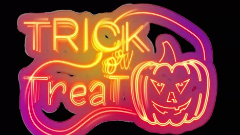 Animation-of-neon-trick-or-treat-with-pumpkin-on-black-background