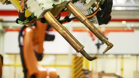 industrial robot welding arm in operation