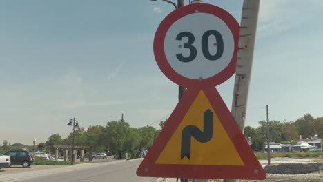 Danger road signs warnings windy road and thirty kilometers per hour
