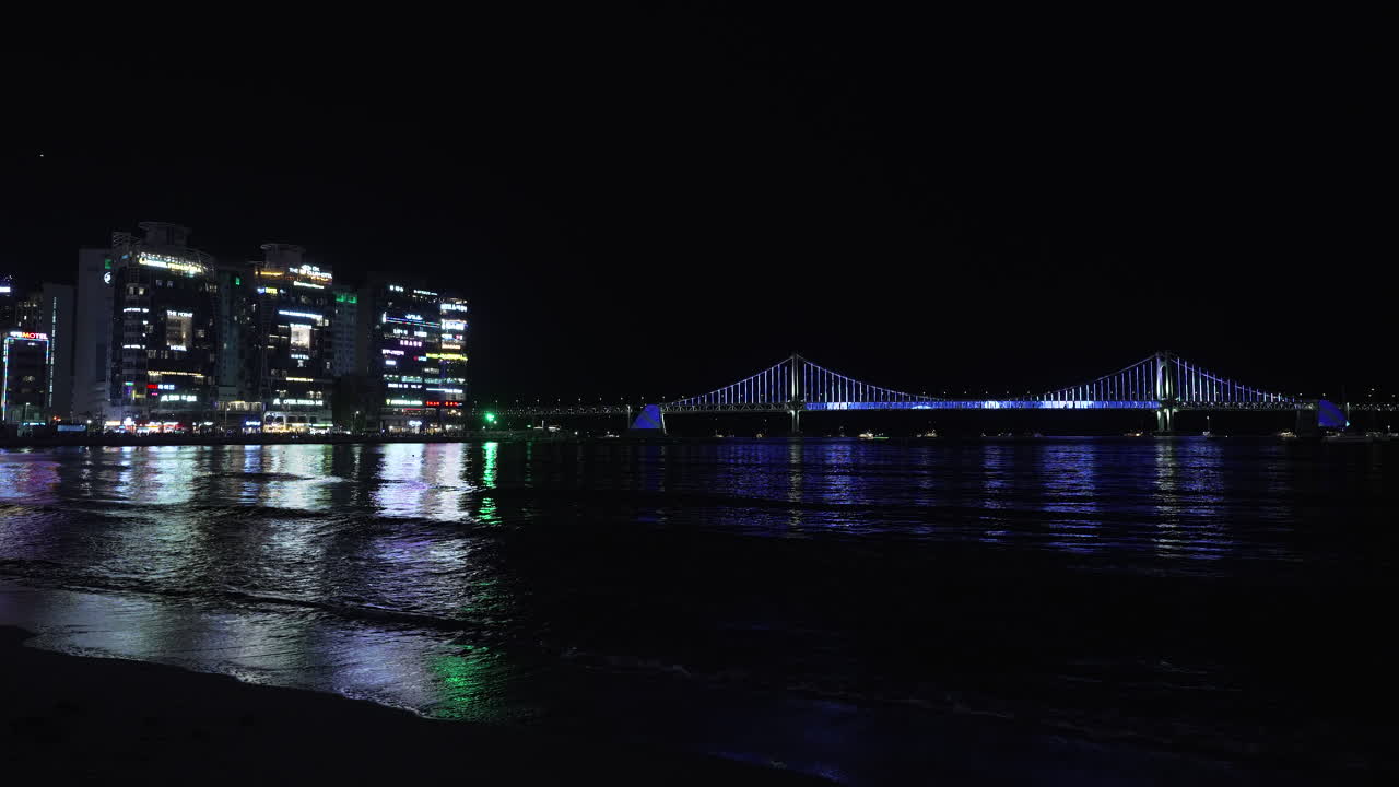 Illuminated Gwangan Bridge Changing Light Colors - Seafront View From Night Gwangalli Beach