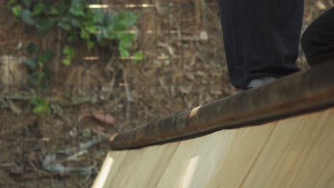 screwing rail on mini ramp, close up