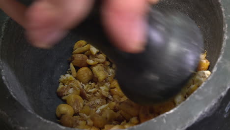 grinding spices in a mortar and pestle