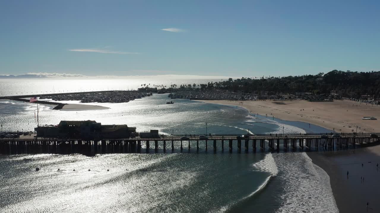 Aerial wide dolly shot of Stearns Wharf in Santa Barbara, California. 4K