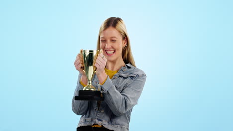 woman, trophy celebration and smile in studio