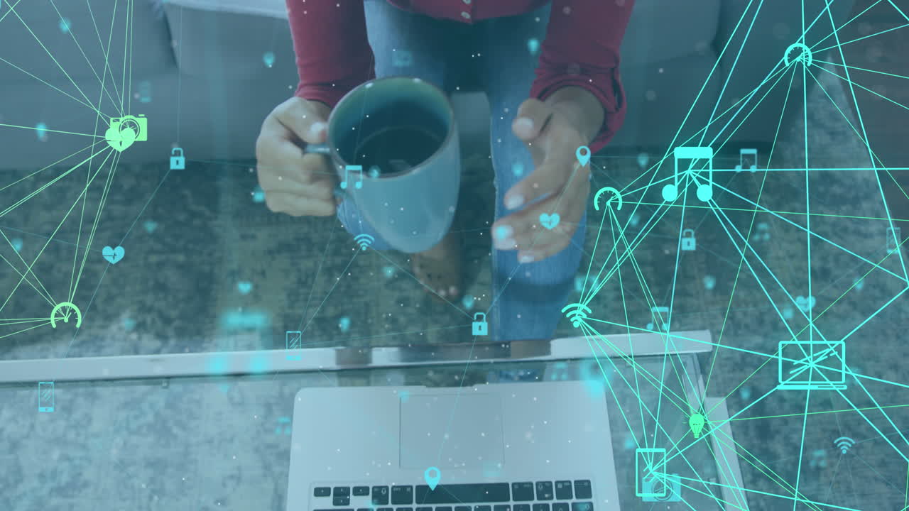 Animation of networks of connections with digital icons over woman using laptop at home