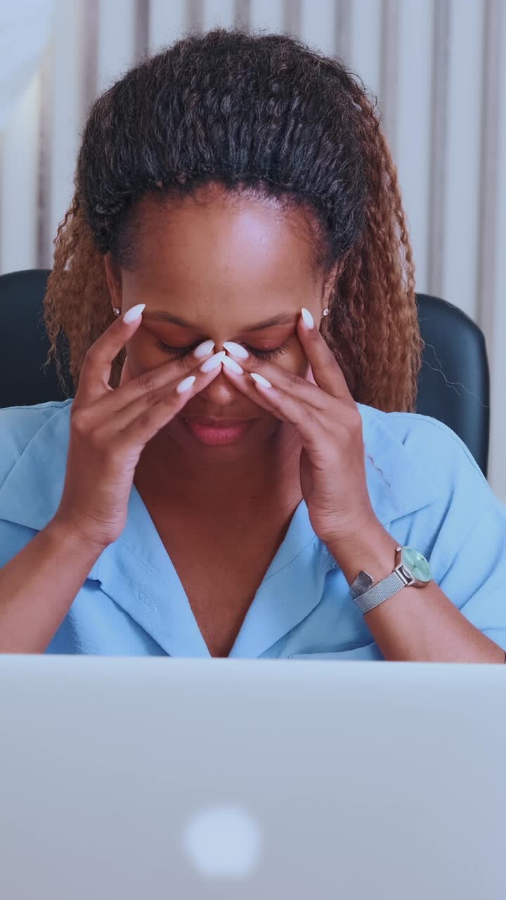 Focused african american woman engaged in productive work at home office