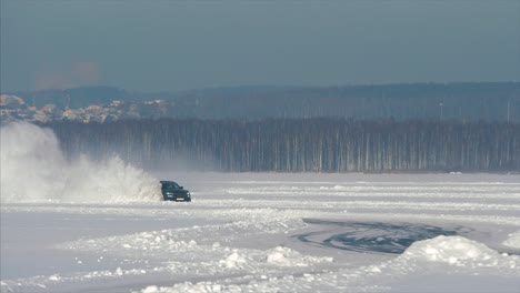 car drifting on frozen lake in winter