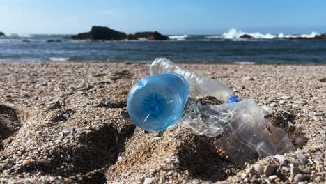 plastic bottles littering a sandy beach, symbolizing pollution and climate change impact