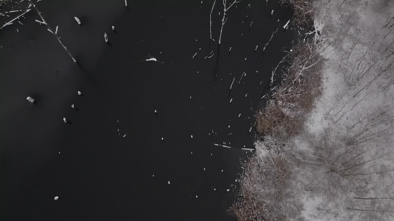 Aerial over ice frozen post industrial mining landscape Heart Lake