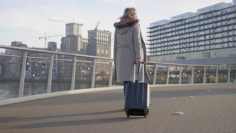 young female tourist explores the city along the bay