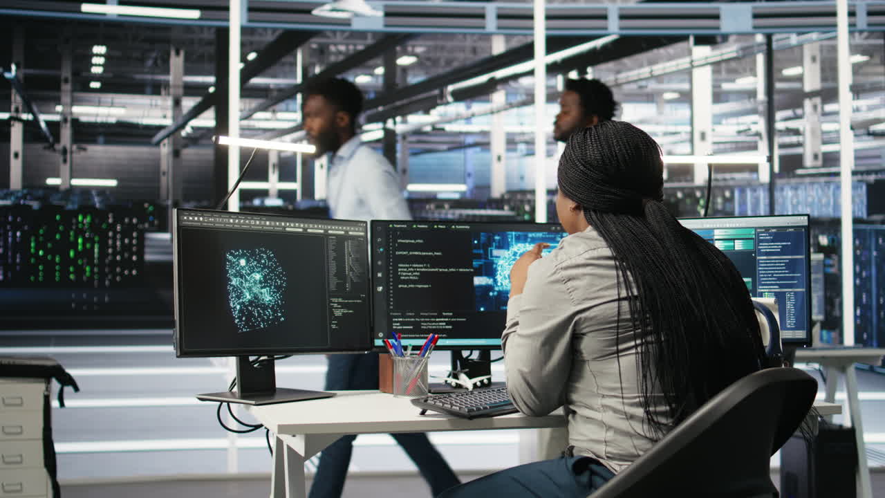 Data center staff member in office using AI deep learning algorithms