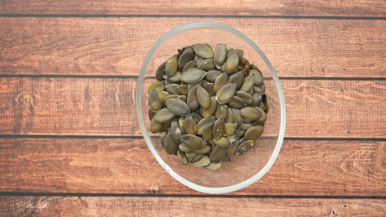 Pumpkin Seeds in a Glass Bowl