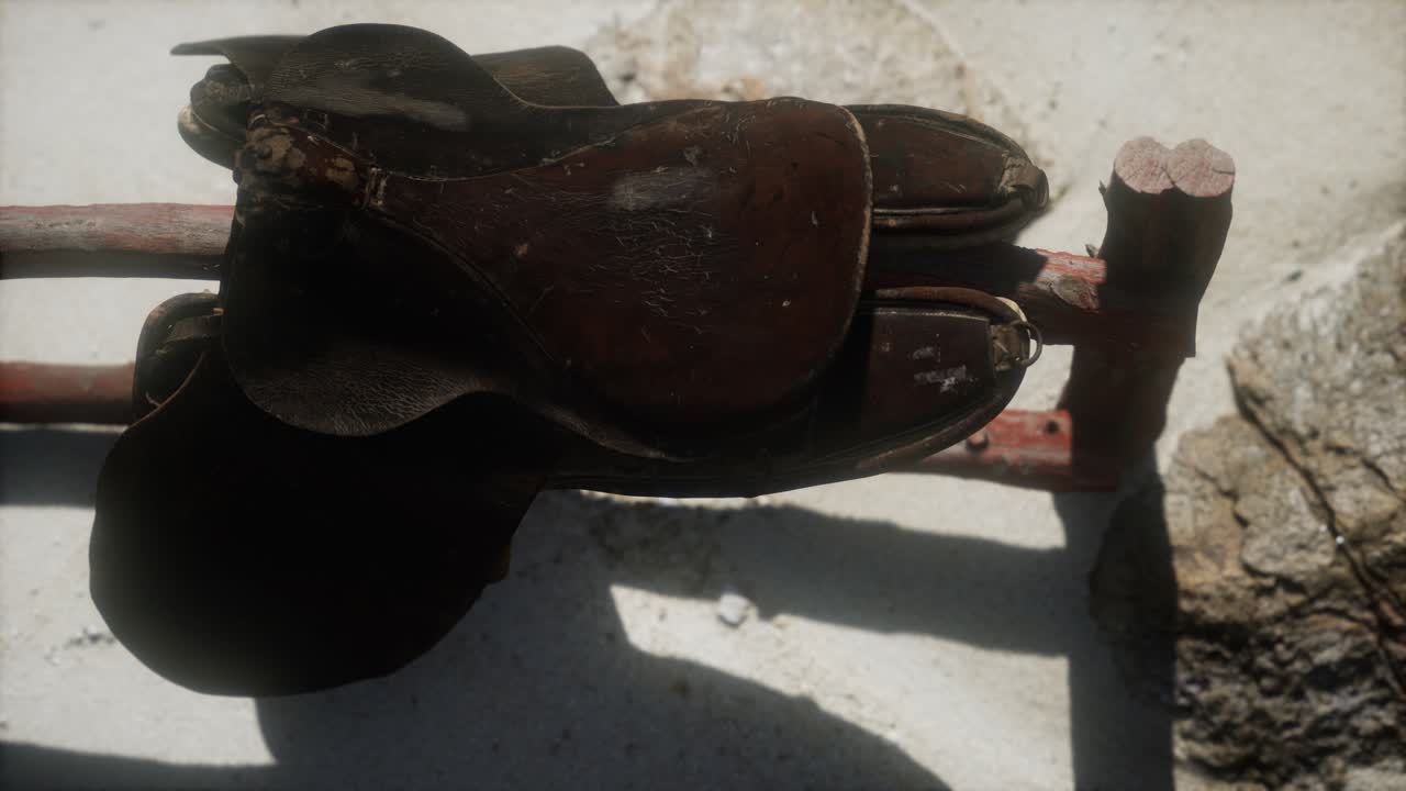 Rider Leather Saddle on fence in desert
