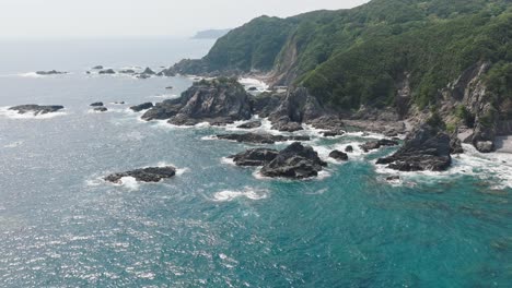 aerial fly blue japanese waters, green cliffs of kochi japan, ashizuri uwakai national park