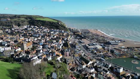 aerial drone shot of hastings uk, orbiting shot, flying over old town looking towards town, ocean and east hill