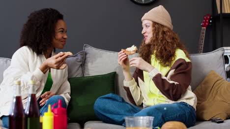 two friends eating at home