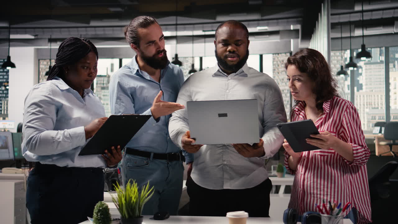 Diverse employees team working on new marketing strategy with reports