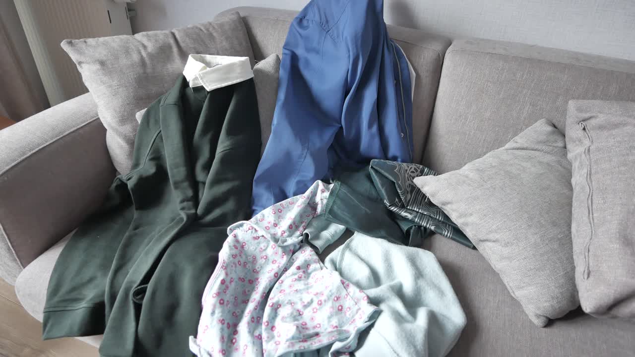 Messy clothes on sofa