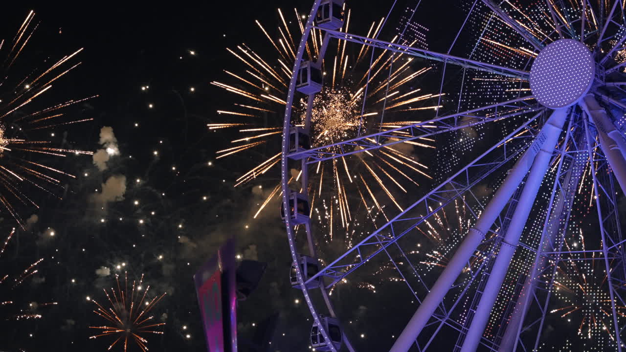 Fireworks and Ferris Wheel at Night
