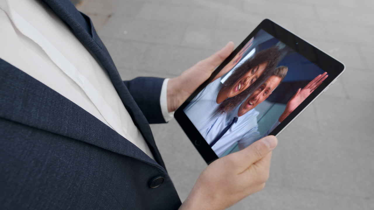 Businessman have distance chat with office colleagues by tablet webcam close up