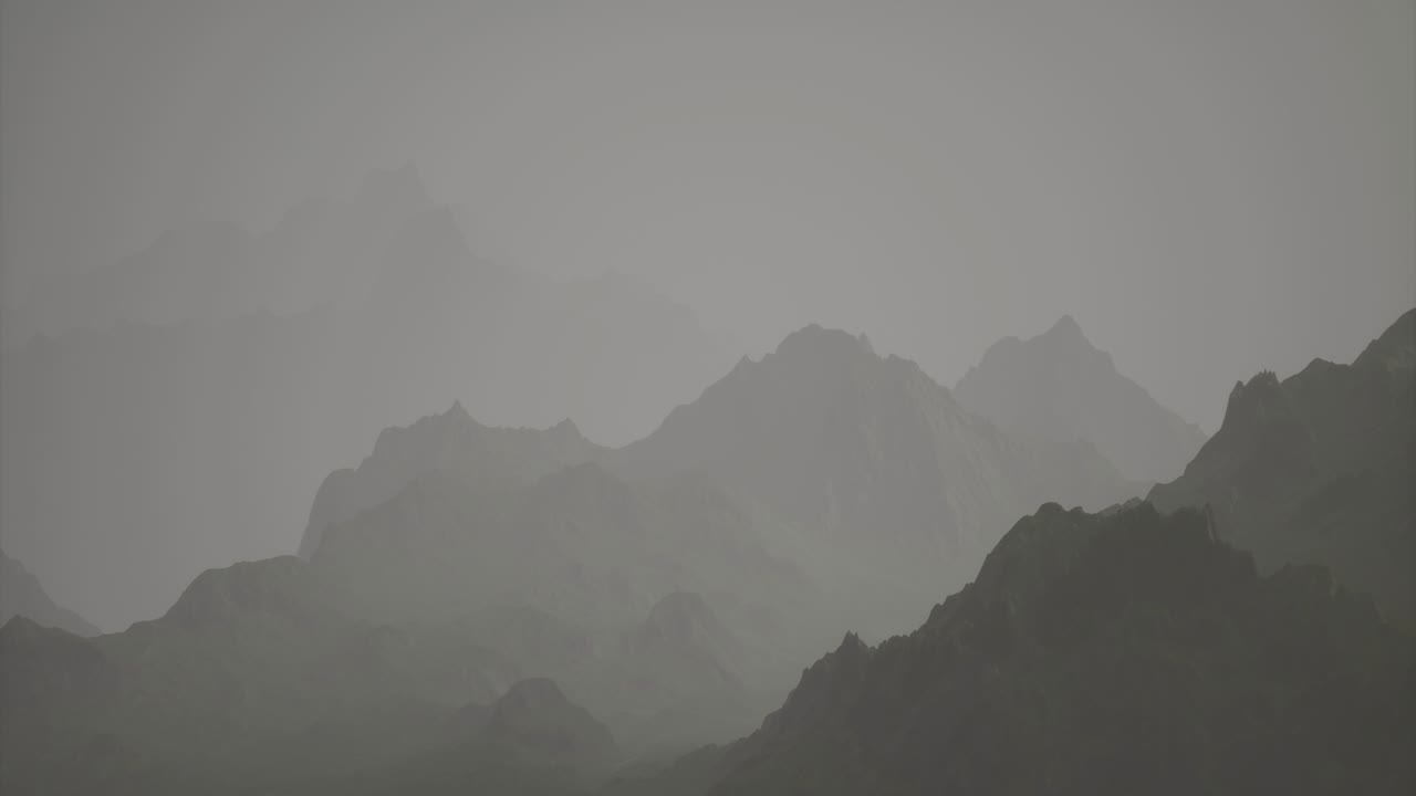 Misty mountain landscape captured during overcast weather in the early morning