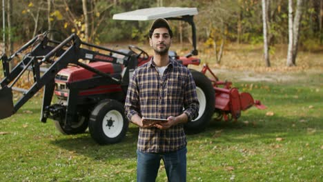 farmer using a tablet in a farm setting