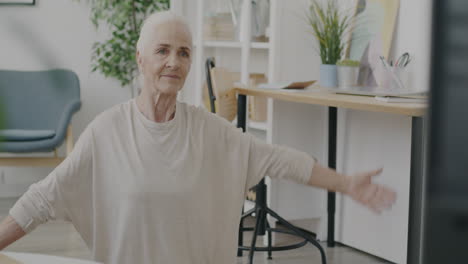 Senior Woman Doing Stretching Exercises at Home