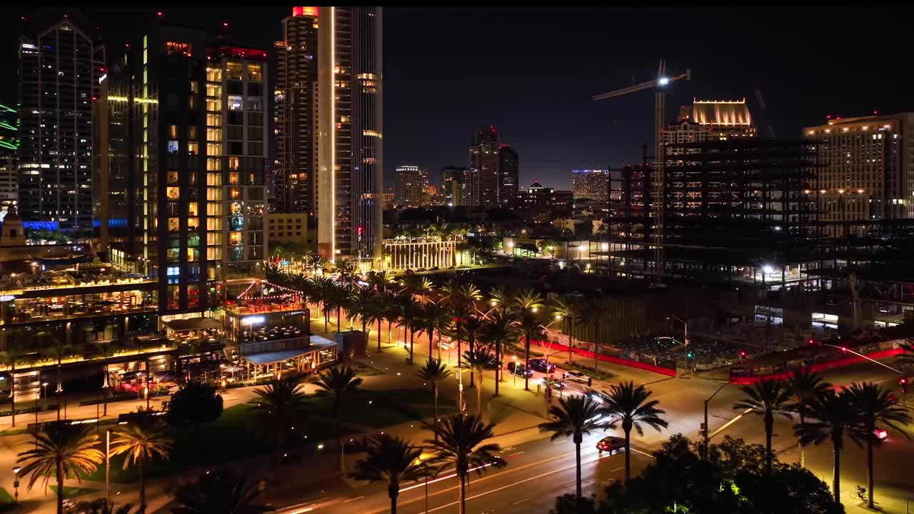 Breathtaking aerial time lapse of downtown San Diego at night, aerial capture over intersection with Embarcadero city glow