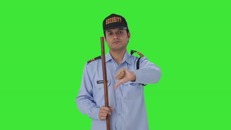 Disappointed-Indian-security-guard-showing-thumbs-down-Green-screen