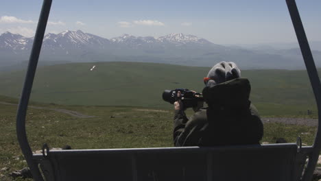 traveler taking nature photo with camera lens moving