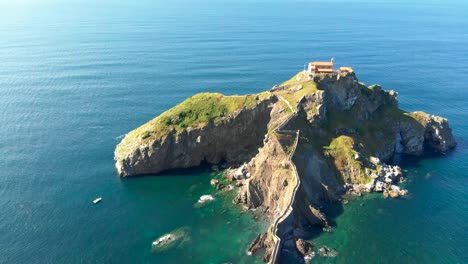 aerial view of gaztelugatxe - an islet in basque country, spain, during a bright sunny day. 4k, uhd