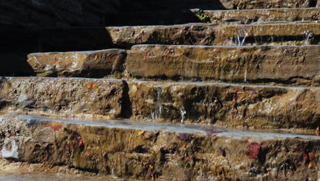 water flows down stone steps