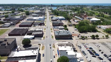 aerial view of a town with a main road leading towards a body of water