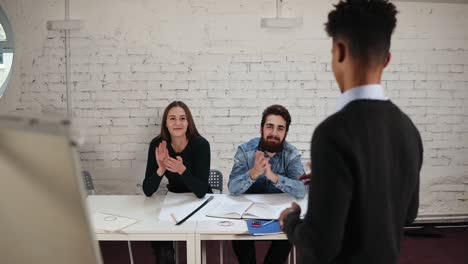 african american office worker finishing corporate presentation for business people in office, dark skinned couch receiving